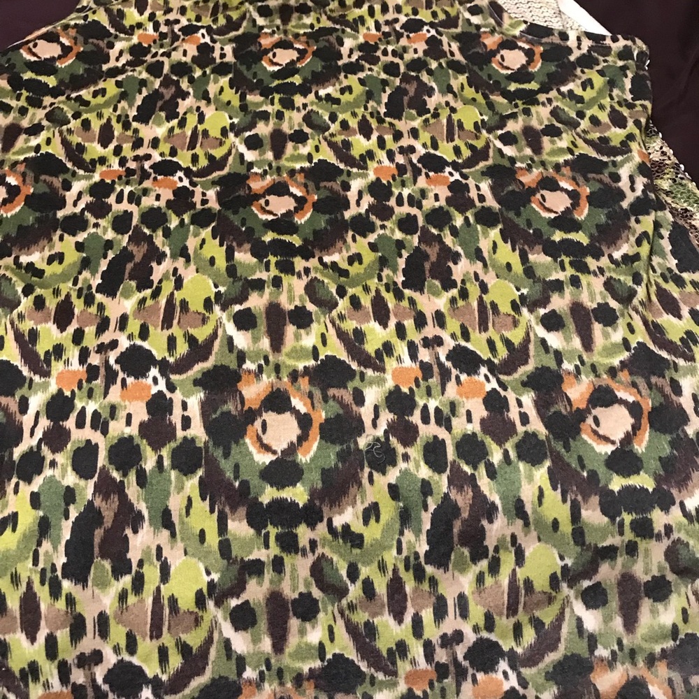 Green and black sequin shirt.